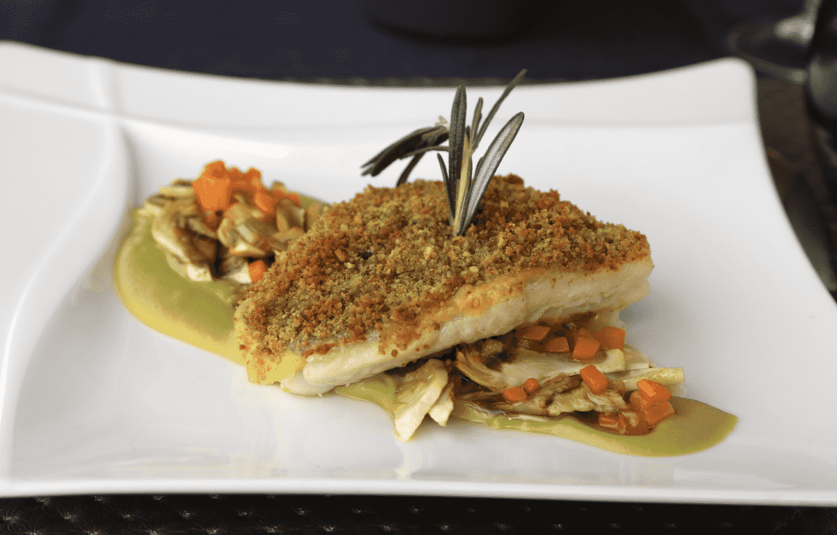 Herb-Crusted Blue Eye Cod Fillet with Mashed Green Peas and Artichokes